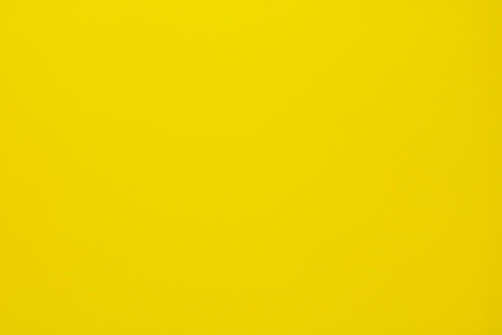 Bright yellow textured background, perfect for design projects and presentations.